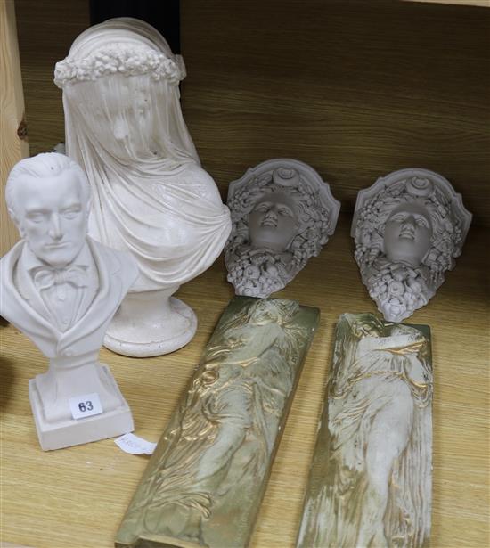 Two plaster busts, a pair of plaster wall shelves and two plaster reliefs